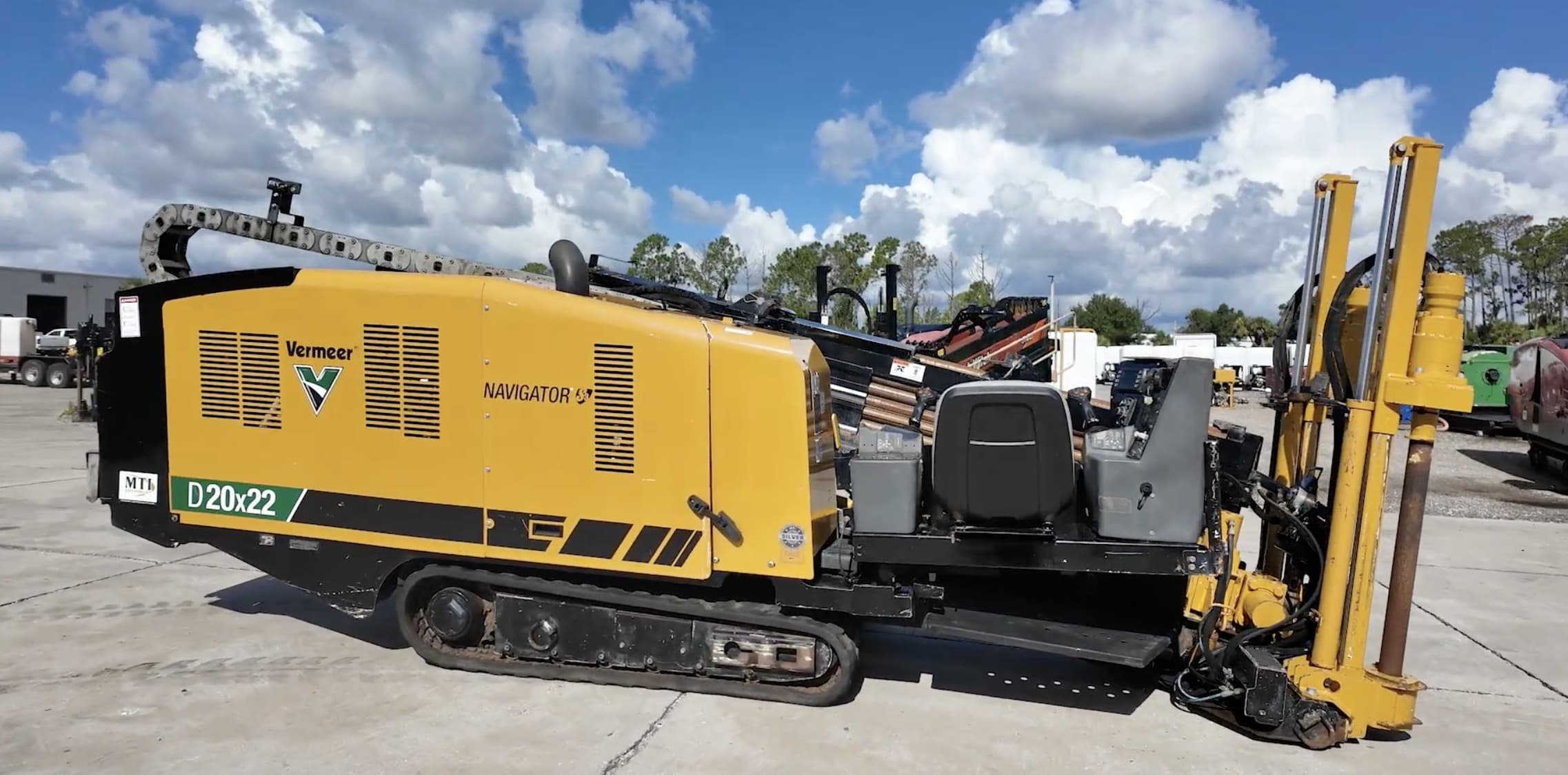 Vermeer D20x22 Navigator directional drill on tracks with the drill frame and rod loader